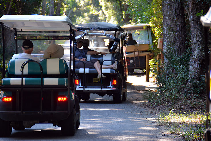 Several golf carts on the streets of Bald Head Island, NC