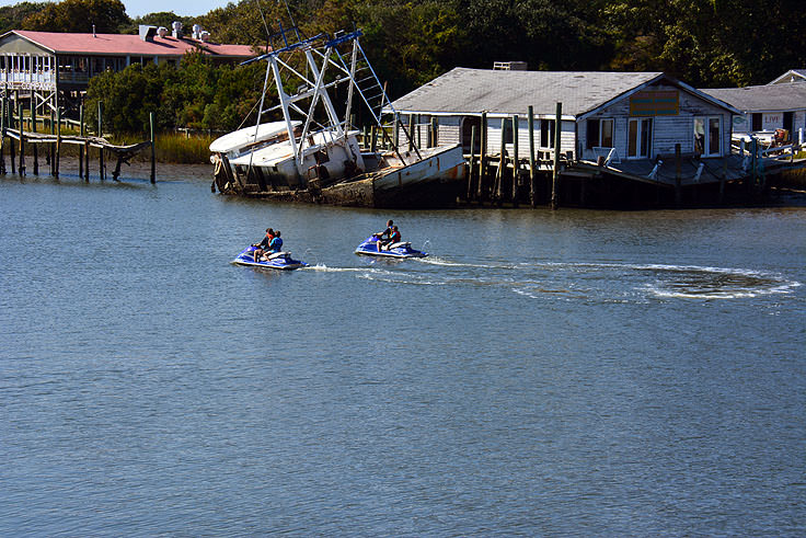 Holden Beach Capefear Nc Jet Skiiers Near An Abandoned Fishing Ship In Holden Beach Nc